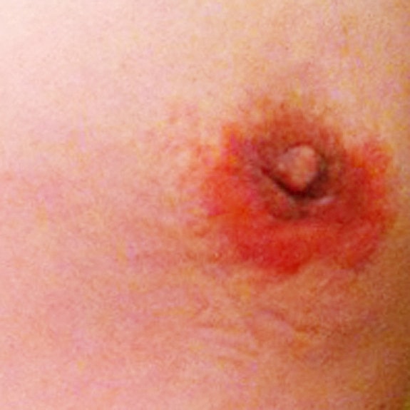 Man's torso against a blue background.