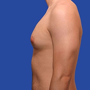 Side profile of a male torso against blue background.