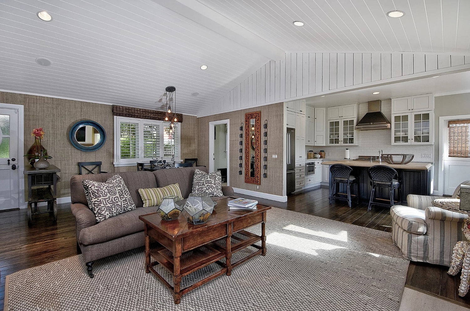 Cozy living room with modern kitchen features.
