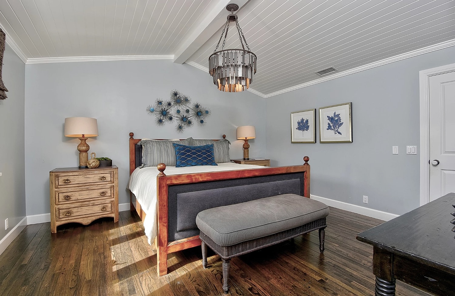 Cozy living room with kitchen in background.