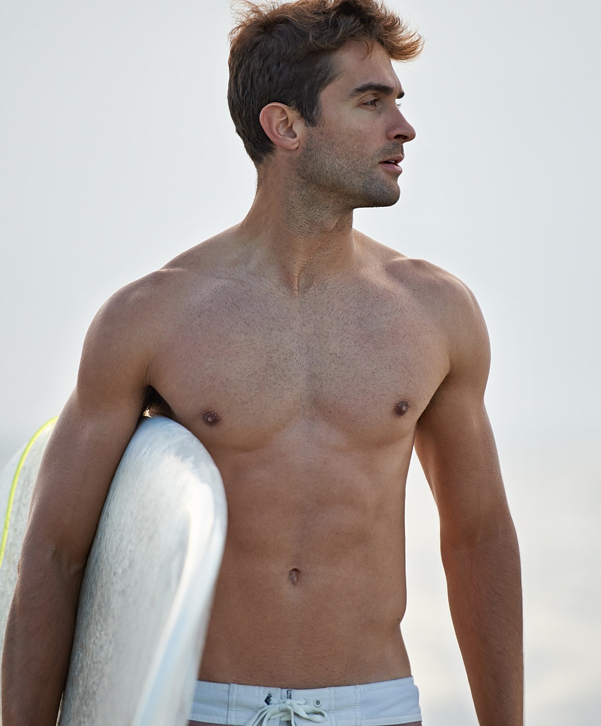 Smiling man in a black polo shirt.