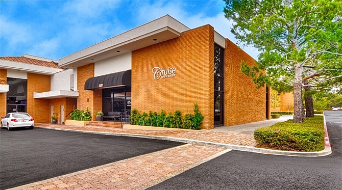 Restaurant exterior with modern architecture and greenery.