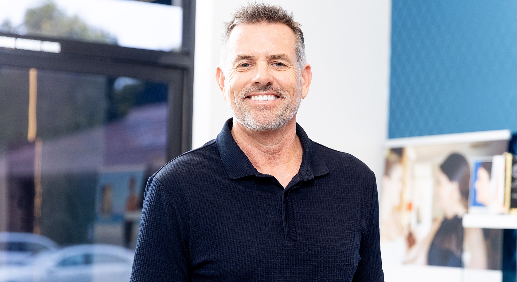 Smiling man in a professional setting.